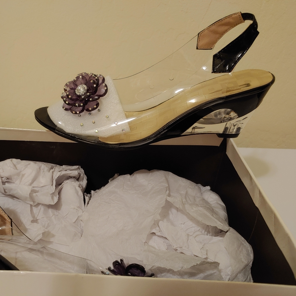 Striking clear plastic and black patent heel